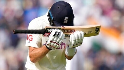 England's Joe Root puts his head on his bat as he leaves the pich after being bowled by India's Shardul Thakur on day five of the fourth Test match at The Oval cricket ground in London, Monday, Sept. 6, 2021. (AP Photo/Kirsty Wigglesworth) (AP) England's Joe Root puts his head on his bat as he leaves the pich after being bowled by India's Shardul Thakur on day five of the fourth Test match at The Oval cricket ground in London, Monday, Sept. 6, 2021. (AP Photo/Kirsty Wigglesworth) (AP)