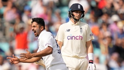 India's Shardul Thakur celebrates taking the wicket of England's Joe Root, right, on day five of the fourth Test match at The Oval cricket ground in London, Monday, Sept. 6, 2021. (AP Photo/Kirsty Wigglesworth) (AP) India's Shardul Thakur celebrates taking the wicket of England's Joe Root, right, on day five of the fourth Test match at The Oval cricket ground in London, Monday, Sept. 6, 2021. (AP Photo/Kirsty Wigglesworth) (AP)