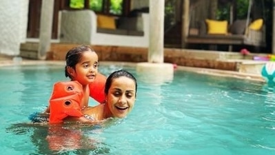 Mother and son seen here chilling in the pool. Mother and son seen here chilling in the pool.