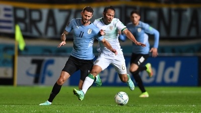 Uruguay's Gaston Pereiro in action with Bolivia's Leonel Justiniano (Pool via REUTERS)