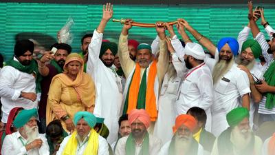Bharatiya Kisan Union spokesperson Rakesh Tikait with other farmer leaders during Kisan Mahapanchayat in Muzaffarnagar, Sunday. (PTI) Bharatiya Kisan Union spokesperson Rakesh Tikait with other farmer leaders during Kisan Mahapanchayat in Muzaffarnagar, Sunday. (PTI)