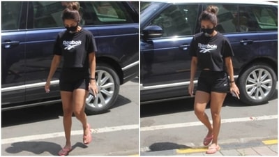Malaika wore a half-sleeve black Reebok crop top and flaunted her toned body in it. (HT Photo/Varinder Chawla)