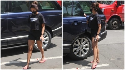 Malaika completed her gym look with a black printed face mask to keep herself safe during the ongoing Covid-19 pandemic. A messy top bun and no-makeup look rounded off Malaika's gym look. (HT Photo/Varinder Chawla)