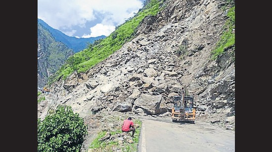 Debris from the landslide on the Shimla-Kinnaur highway near Jeori in Rampur is being removed to restore traffic. (HT Photo)