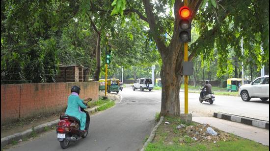 Traffic lights installed at the entry point of the slip road of the Sector 26 grain market chowk in Chandigarh. (Keshav Singh/HT)