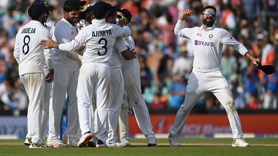 India celebrate the wicket of Chris Woakes in the last over before tea.&nbsp;(Getty)