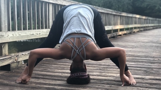 3.Prasarita padottasana or wide-legged standing forward bend: Keep a parallel distance of about 3 to 4 feet between your legs and place your hands on your hips. With your legs and spine intensely stretched, inhale, lift your chest up tall through your whole torso and fold slowly over your legs. Begin to stretch your torso forward by placing your hands flat on the floor and keeping them shoulder-width apart. Fold deeper, bringing your head toward the floor.