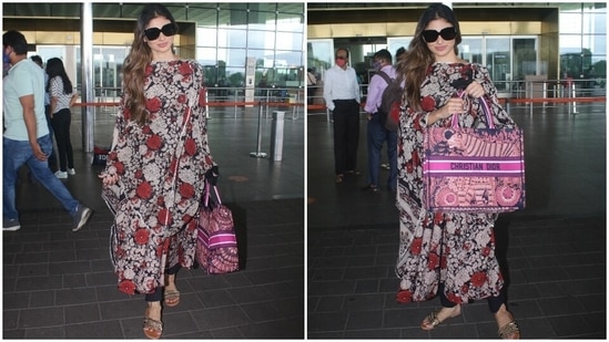 Mouni also carried a Christian Dior Book Tote Embroidered Canvas Bag with her airport ensemble. The luxurious bag is worth <span class='webrupee'>₹</span>2,19,260 (USD 3,000).(HT Photo/Varinder Chawla)