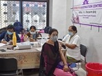 A medical worker inoculates a woman with a dose of the Covishield vaccine against the Covid-19 coronavirus at a hospital in Allahabad. A medical worker inoculates a woman with a dose of the Covishield vaccine against the Covid-19 coronavirus at a hospital in Allahabad.