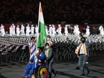 Para javelin thrower Tek Chand holding the Indian tri-colour at the Tokyo Paralaympics 2020 opening ceremony