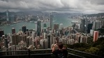 A visitor sets up his camera in the Victoria Peak area to photograph Hong Kong's skyline. Travellers arriving in Hong Kong from China will no longer need to quarantine.(AP Photo/Jae C. Hong, File) A visitor sets up his camera in the Victoria Peak area to photograph Hong Kong's skyline. Travellers arriving in Hong Kong from China will no longer need to quarantine.(AP Photo/Jae C. Hong, File)