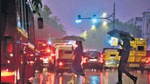 Commuters caught in the rain at Connaught Place, on Tuesday. (Raj K Raj/Hindustan Times) Commuters caught in the rain at Connaught Place, on Tuesday. (Raj K Raj/Hindustan Times)