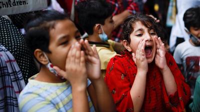 Children shout slogans, as Afghan nationals attend a protest outside the United Nations High Commissioner for Refugees (UNHCR) office to urge the international community to help Afghan refugees, in New Delhi, India, September 1, 2021. REUTERS/Adnan Abidi (REUTERS) Children shout slogans, as Afghan nationals attend a protest outside the United Nations High Commissioner for Refugees (UNHCR) office to urge the international community to help Afghan refugees, in New Delhi, India, September 1, 2021. REUTERS/Adnan Abidi (REUTERS)