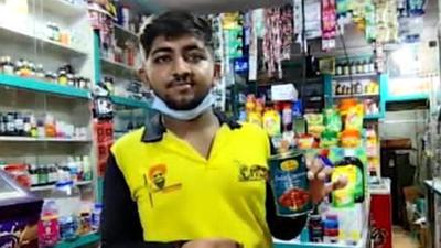 The owner shows the half-finished can of gulab jamuns that the thief ate from before stealing Rs50,000. Virar police have seized the can for forensic analysis. (HT)