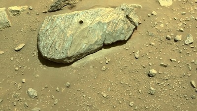 Perseverance uses a drill and a hollow coring bit at the end of its 7-foot-long (2-meter-long) robotic arm to extract samples. (AFP)