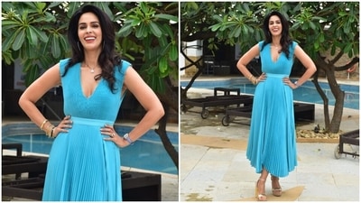 Mallika accompanied Esha for the event in a light blue pleated midi dress. The fit-and-flare ensemble featured a plunging neckline, tulle pleats, asymmetric hemline, and fabric belt on the waist to cinch it together. (HT Photo/Varinder Chawla)