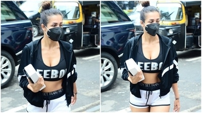 Malaika wore the monochrome set with a baggy black-and-white jacket and left the front zipper open. She completed the look with a black face mask and pink flip flops. (HT Photo/Varinder Chawla)