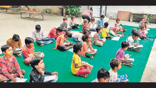 Students learning in a complex near Red Fort. Students learning in a complex near Red Fort.
