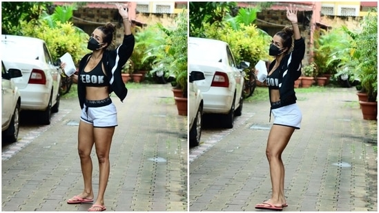 Malaika Arora wears a white Reebok sports bra with matching shorts