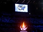 The Tokyo 2020 Olympics Closing Ceremony - Olympic Stadium, Tokyo, Japan - August 8, 2021. The Olympic torch and cauldron are seen with Paris 2024 displayed on the big screen during the closing ceremony.(REUTERS)