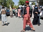 Taliban fighters keep vigil as Afghan women take part in an anti-Pakistan demonstration in Kabul. Taliban fighters keep vigil as Afghan women take part in an anti-Pakistan demonstration in Kabul.