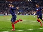 France's Antoine Griezmann celebrates scoring their second goal with Leo Dubois&nbsp;(REUTERS)