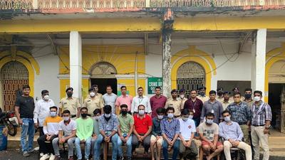 Police with the gang in Goa on Wednesday. (Sourced)
