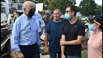 US President Joe Biden (left) tours a neighbourhood affected by Hurricane Ida in Manville, New Jersey on Wednesday. (AFP) US President Joe Biden (left) tours a neighbourhood affected by Hurricane Ida in Manville, New Jersey on Wednesday. (AFP)
