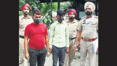 Two members of an inter-state gang in custody of Khanna police on Wednesday. (HT Photo)