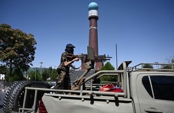 A member of the Taliban Fateh fighter, a "special forces" unit, patrol on a vehicle around Massoud square in Kabul (AFP)