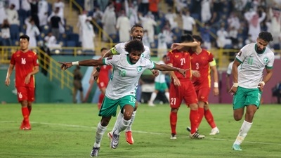 Saudi Arabia's Yasser al-Shahrani (C) celebrates with teammates during the 2022 Qatar football World Cup Asian qualification Saudi Arabia's Yasser al-Shahrani (C) celebrates with teammates during the 2022 Qatar football World Cup Asian qualification
