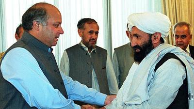 In this file photo taken on August 26, 1999 Pakistani Prime Minister Nawaz Sharif receives Afghan Foreign Minister Mullah Mohammad Hassan Akhund (R) in Islamabad. The Taliban announced Mullah Mohammad Hasan Akhund as the leader of their new government in Afghanistan on September 7, 2021. (AFP) In this file photo taken on August 26, 1999 Pakistani Prime Minister Nawaz Sharif receives Afghan Foreign Minister Mullah Mohammad Hassan Akhund (R) in Islamabad. The Taliban announced Mullah Mohammad Hasan Akhund as the leader of their new government in Afghanistan on September 7, 2021. (AFP)