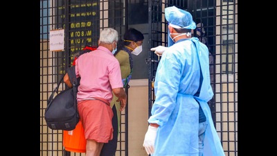 A health worker directs suspected Nipah virus patients to an isolation centre in Kozhikode Medical College in Kerala. (PTI PHOTO.) A health worker directs suspected Nipah virus patients to an isolation centre in Kozhikode Medical College in Kerala. (PTI PHOTO.)