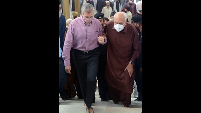Former J&K CM Omar Abdullah helping his father and National Conference chief Farooq Abdullah climb the stairs prior to paying tributes to party founder Sheikh Mohammad Abdullah on his 39th death anniversary at his grave on the outskirts of Srinagar on Wednesday. (ANI) Former J&K CM Omar Abdullah helping his father and National Conference chief Farooq Abdullah climb the stairs prior to paying tributes to party founder Sheikh Mohammad Abdullah on his 39th death anniversary at his grave on the outskirts of Srinagar on Wednesday. (ANI)