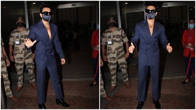 No look of Ranveer Singh is complete without his infamous quirky element. And he made sure to make his jet-set outfit look cool by rocking it with a double ponytail. Yes, you read that right. The actor tied his hair in a sleeked-back style. What do you think of his look? (HT Photo/Varinder Chawla)