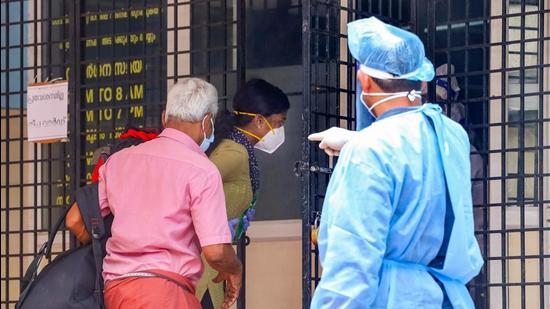 A health worker directs the suspected Nipah virus patients at Nipah virus isolation centre in Kozhikode Medical college, on September 7. (PTI)