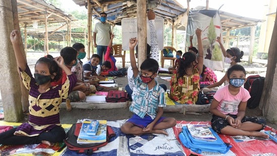 Children attend a special class organised by NGO Towards Future, at a temporary market place in Kashinathpur Bazar, Rajarhat, West Bengal, on September 4. (Samir Jana / HT Photo)