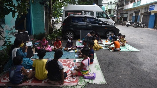 Children attend the thrice a week special class under the Nabadisha project, at Dhakuria in Kolkata, on September 7. Around 64 children enrolled for these special classes and around 52 are now attending.(Samir Jana / HT Photo)