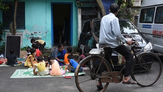 Children attend the thrice a week special class under the Nabadisha project, at Dhakuria in Kolkata, on September 7. Each batch consists of around 12 students and lasts for approximately three hours.(Samir jana / HT Photo)