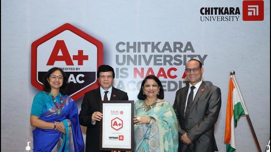 Chitkara University Chancellor Ashok K Chitkara and Pro Chancellor Madhu Chitkara showing the NAAC A+ certificate received by the varsity. (HT Photo)