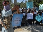 A Taliban fighter stands guard as Afghan women take part in an anti-Pakistan protest in Kabul, on Wednesday. A Taliban fighter stands guard as Afghan women take part in an anti-Pakistan protest in Kabul, on Wednesday.