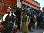 Taliban fighters arrive to shop at Bush market in Kabul. Taliban fighters arrive to shop at Bush market in Kabul.