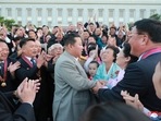 North Korean leader Kim Jong Un greets people during an event to mark the 73rd founding anniversary of North Korea in Pyongyang.