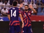 United States' Sebastian Lletget, right, celebrates with his teammate Ricardo Pepi after scoring his side's fourth goal against Honduras during a qualifying soccer match for the FIFA World Cup Qatar 2022, in San Pedro Sula, Honduras.