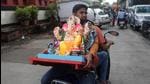 A devotee carries an idol of Ganesh, the deity of prosperity, on a scooter, on the eve of the Ganesh Chaturthi festival. (REUTERS) A devotee carries an idol of Ganesh, the deity of prosperity, on a scooter, on the eve of the Ganesh Chaturthi festival. (REUTERS)