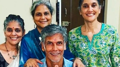 In another, Milind Soman can be seen sitting in the centre with his hands joined while his sisters stand behind him. (Instagram/@milindrunning)