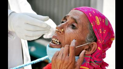 A healthcare worker collects a nasal sample for the Covid-19 test at Regional Hospital in Kullu on Wednesday. (Ajay Kumar)