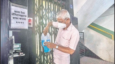 A watchman of a housing society in Karve nagar refills a sanitiser dispenser at the entrance to the elevator. A notice written in Marathi asks that the sanitiser be used by all, before and after use of the lift. As per Pune district’s estimated population, more than 8.53 million people are eligible to get the vaccine doses. (PRATHAM GOKHALE/HT) A watchman of a housing society in Karve nagar refills a sanitiser dispenser at the entrance to the elevator. A notice written in Marathi asks that the sanitiser be used by all, before and after use of the lift. As per Pune district’s estimated population, more than 8.53 million people are eligible to get the vaccine doses. (PRATHAM GOKHALE/HT)