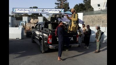 Members of the Taliban guard the entrance to Hamid Karzai International Airport in Kabul, Afghanistan. (REUTERS) Members of the Taliban guard the entrance to Hamid Karzai International Airport in Kabul, Afghanistan. (REUTERS)