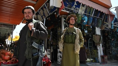 Taliban fighters arrive to shop at Bush market in Kabul. (AFP)
